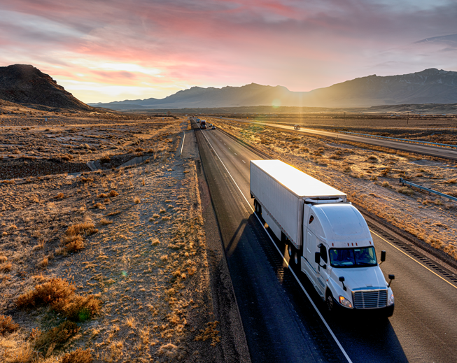 Truck on highway sunset